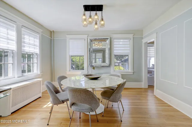 a kitchen with stainless steel appliances granite countertop a stove top oven a sink dishwasher and cabinets with wooden floor