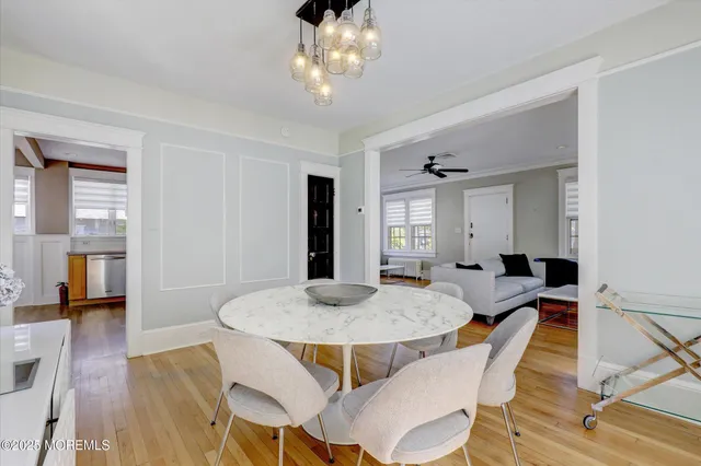 a kitchen with a refrigerator sink and cabinets