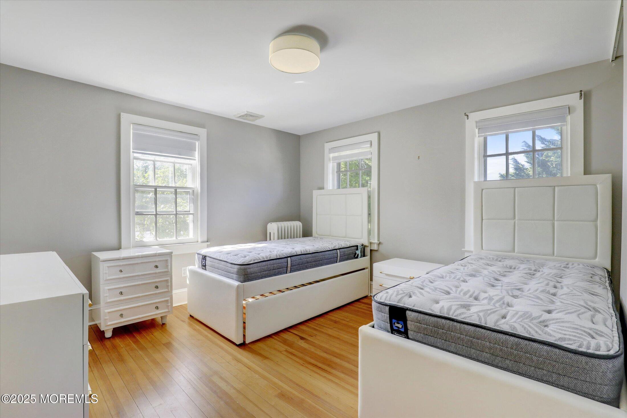 603 Laurel Avenue West Allenhurst, NJ 07711 - Photo 18 of 67 a bedroom with a bed and a window