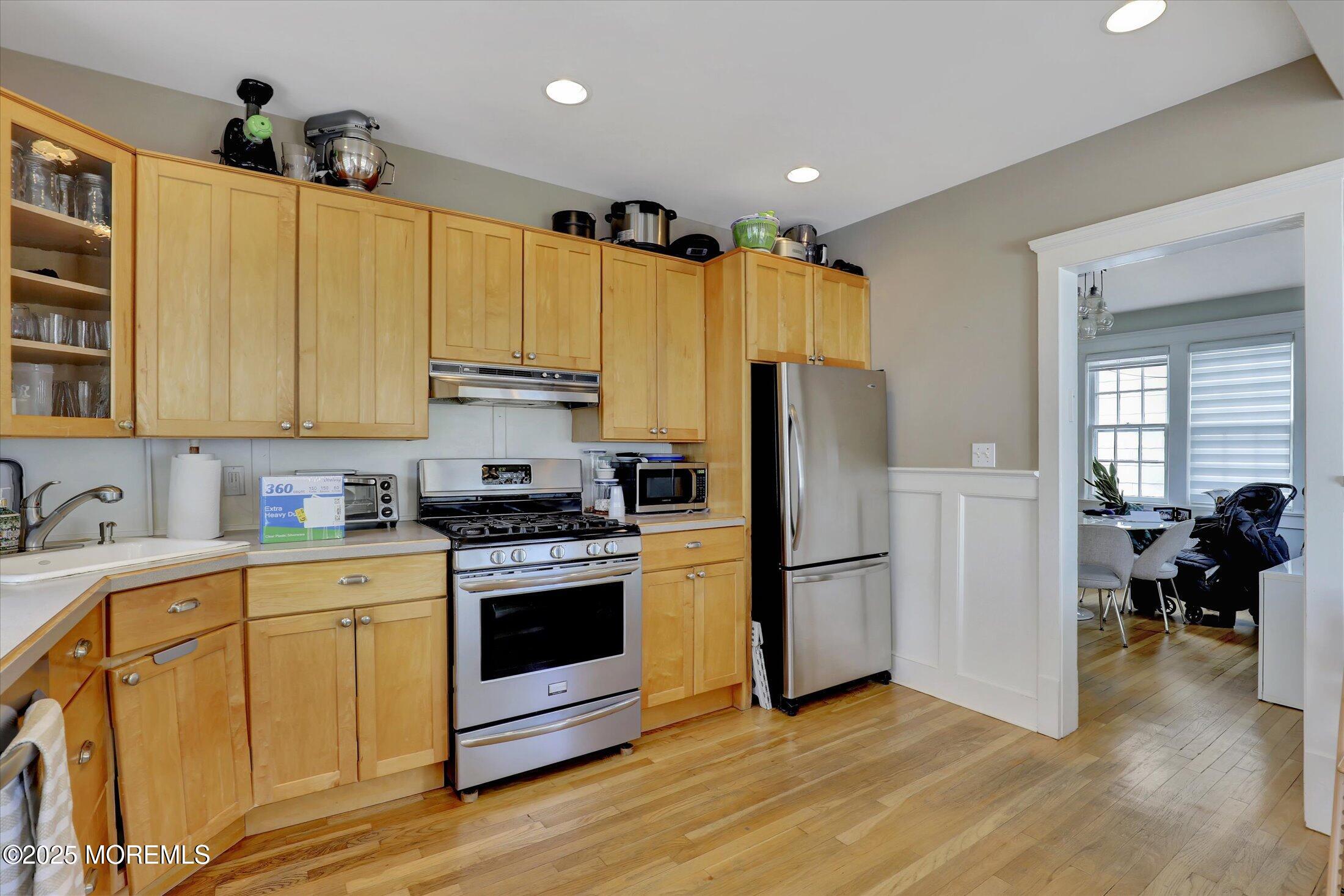 603 Laurel Avenue West Allenhurst, NJ 07711 - Photo 50 of 67 a kitchen with stainless steel appliances granite countertop a refrigerator a stove and a sink