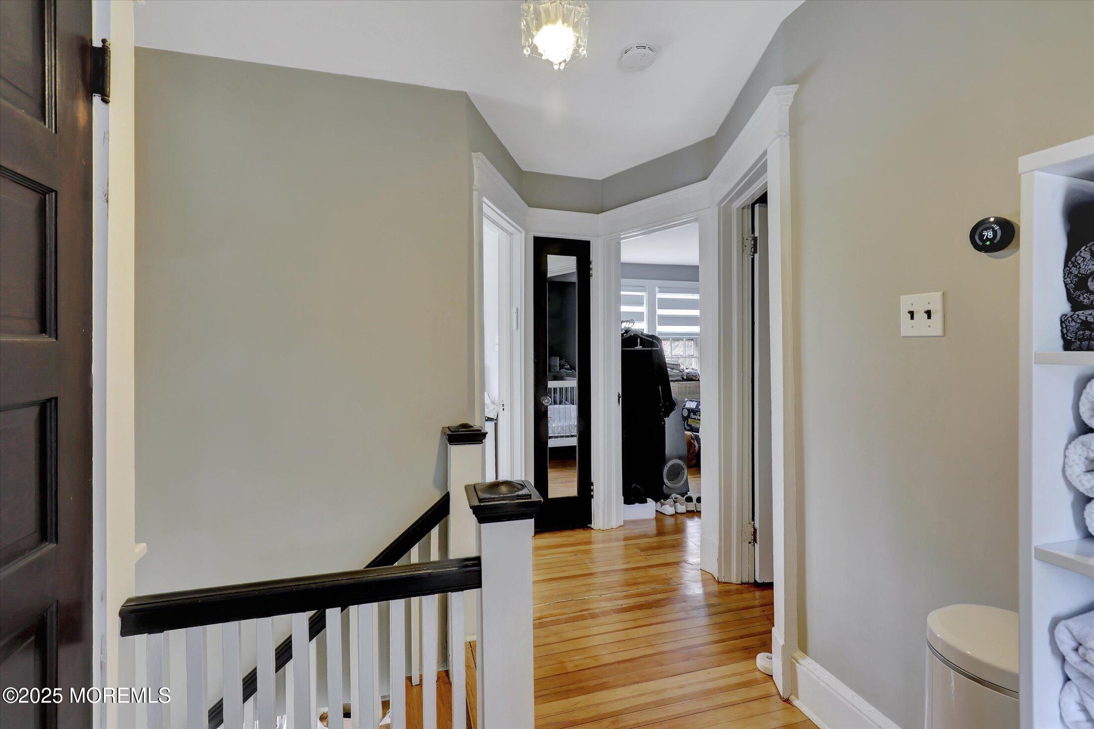 603 Laurel Avenue West Allenhurst, NJ 07711 - Photo 51 of 67 a view of a hallway with wooden floor and stairs
