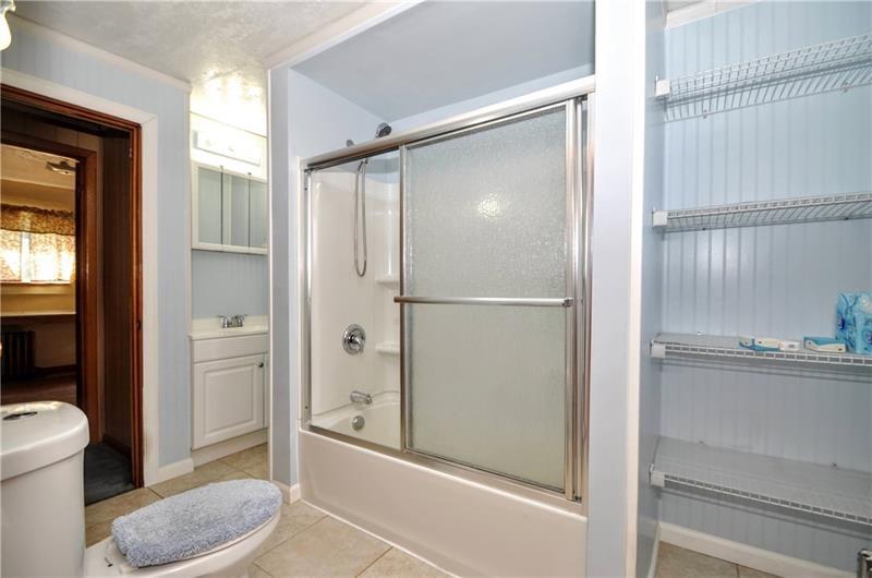 505 Noblestown Road Carnegie, PA 15106 - Photo 18 of 24 a bathroom with a toilet and a shower