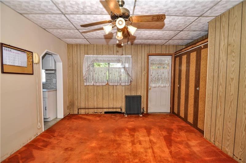 505 Noblestown Road Carnegie, PA 15106 - Photo 8 of 24 a view of a livingroom with a chandelier fan and windows