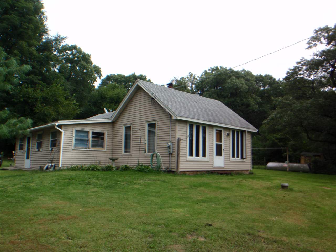 8587 Pomeroy Road Rockton, IL 61072 - Photo 1 of 20 a view of a house with backyard and garden