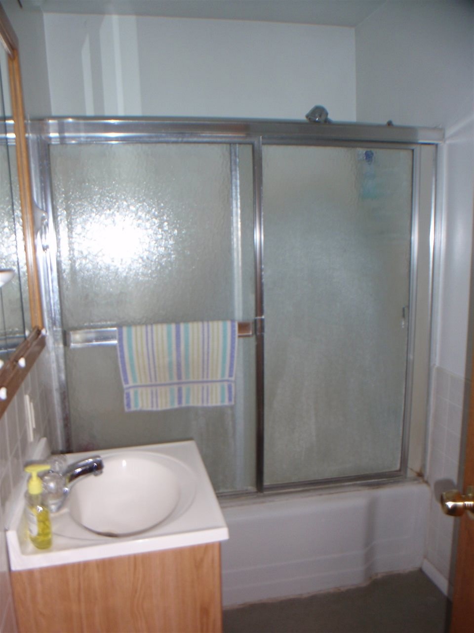 8587 Pomeroy Road Rockton, IL 61072 - Photo 11 of 20 a bathroom with a sink and shower