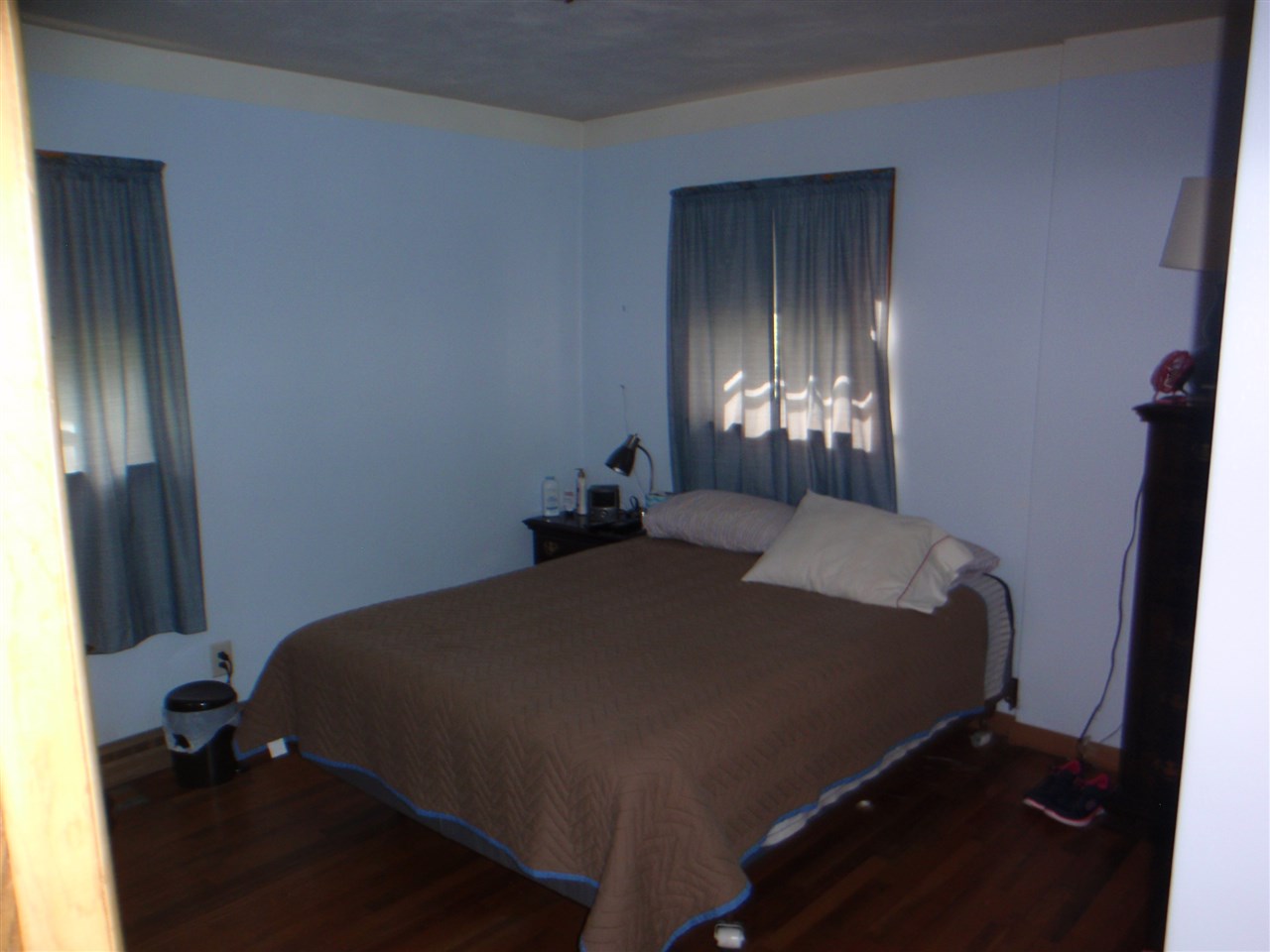 8587 Pomeroy Road Rockton, IL 61072 - Photo 13 of 20 a bed sitting in a bedroom next to a window
