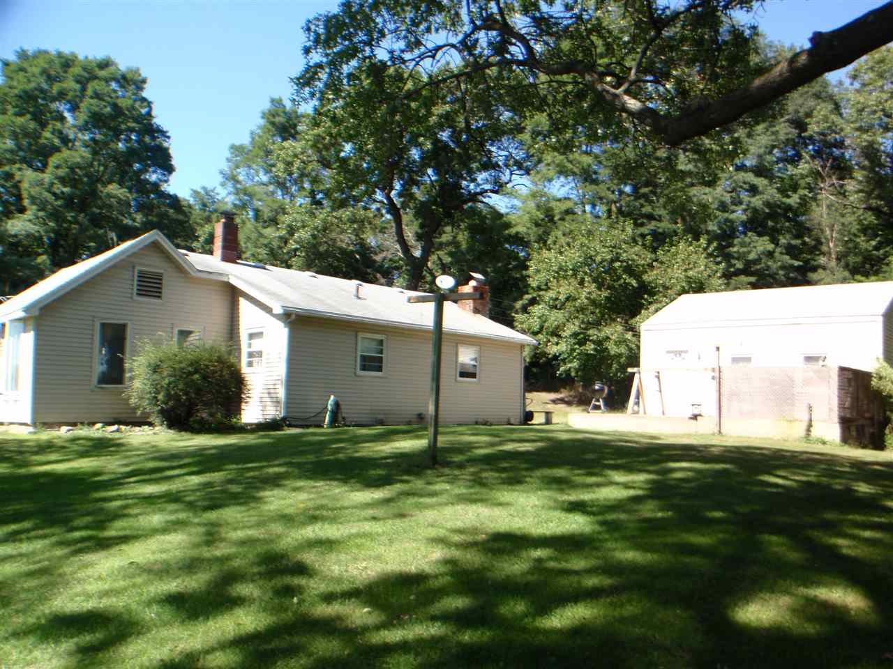 8587 Pomeroy Road Rockton, IL 61072 - Photo 2 of 20 a view of a white house with a yard