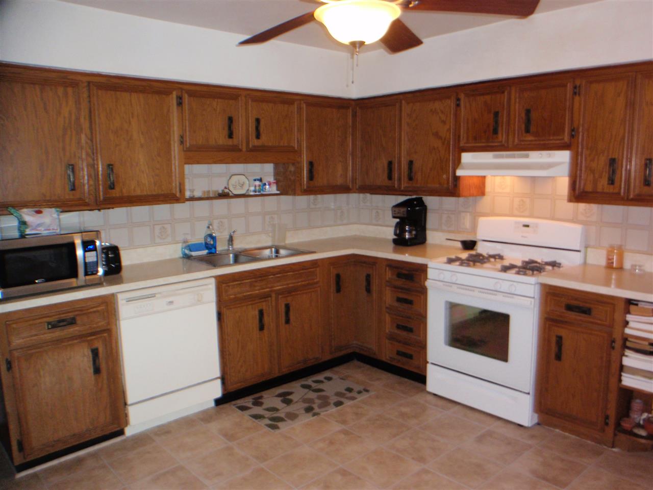 8587 Pomeroy Road Rockton, IL 61072 - Photo 3 of 20 a kitchen with cabinets appliances and a sink