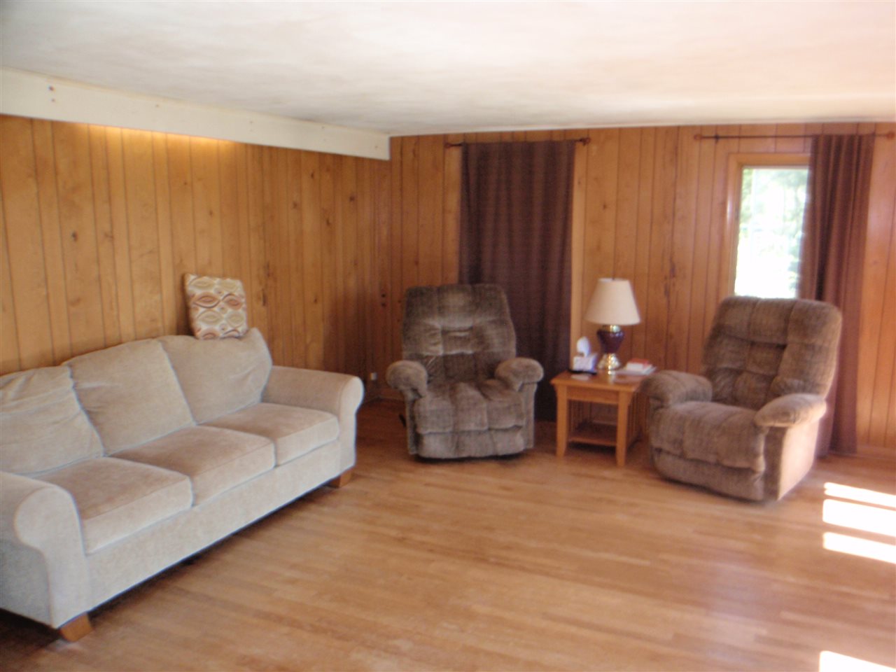 8587 Pomeroy Road Rockton, IL 61072 - Photo 6 of 20 a living room with furniture and a large window