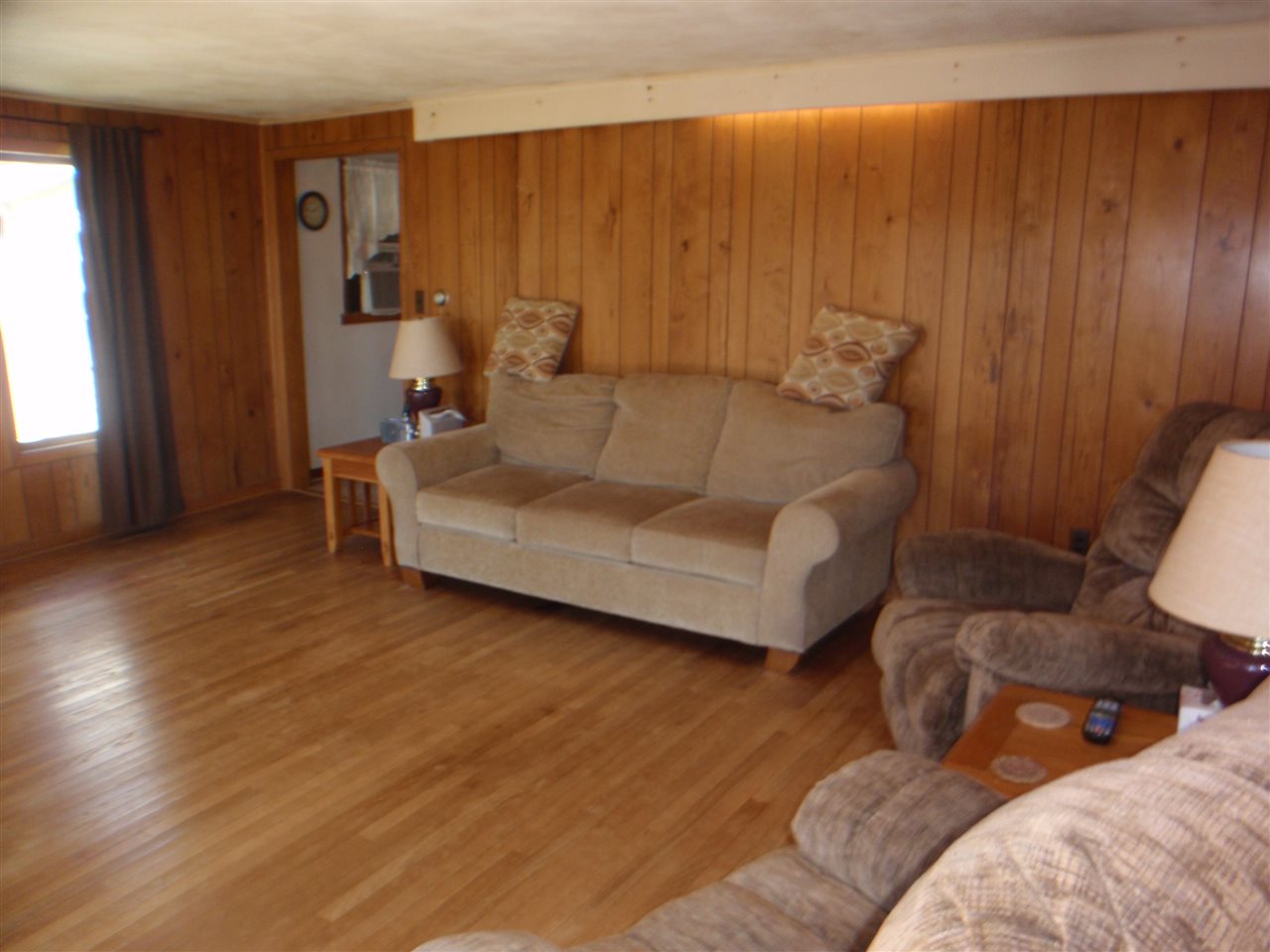 8587 Pomeroy Road Rockton, IL 61072 - Photo 7 of 20 a living room with furniture and a window
