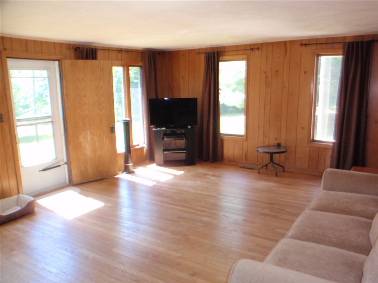 8587 Pomeroy Road Rockton, IL 61072 - Photo 8 of 20 a living room with furniture and a flat screen tv