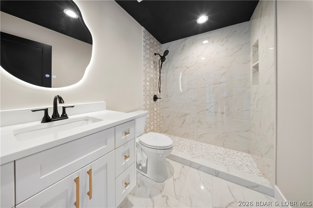 439 Red Bud Road Lake Ozark, MO 65049 - Photo 71 of 98 Stylish lower-level bathroom with custom vanity, m