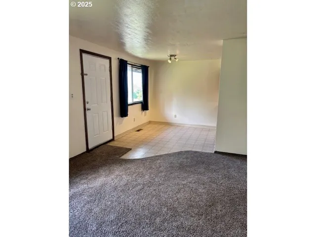 a view of a hallway with brick walls