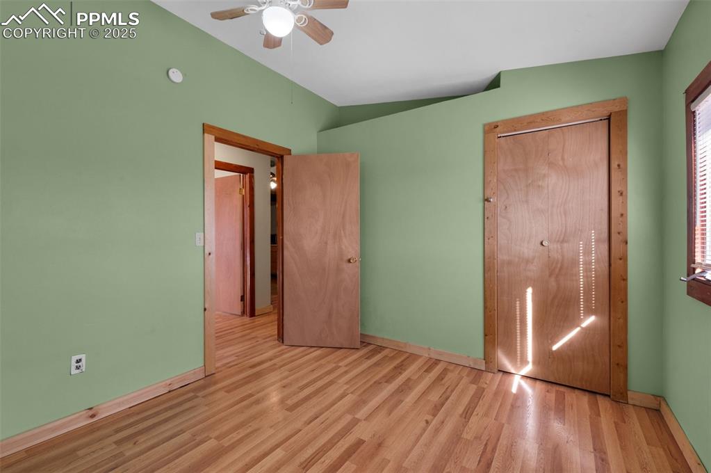 27720 Mid Jones Road Calhan, CO 80808 - Photo 14 of 43 a view of empty room with wooden floor