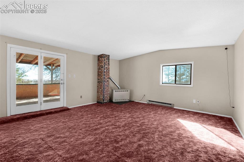 27720 Mid Jones Road Calhan, CO 80808 - Photo 18 of 43 an empty room with windows