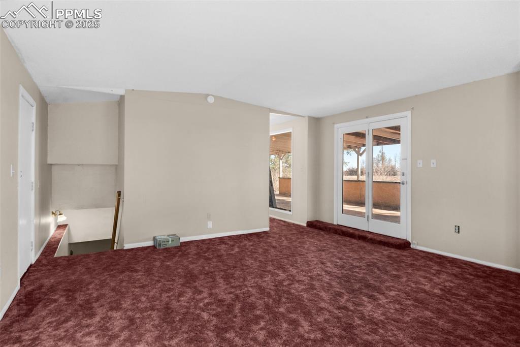 27720 Mid Jones Road Calhan, CO 80808 - Photo 19 of 43 a view of empty room with wooden floor and fan