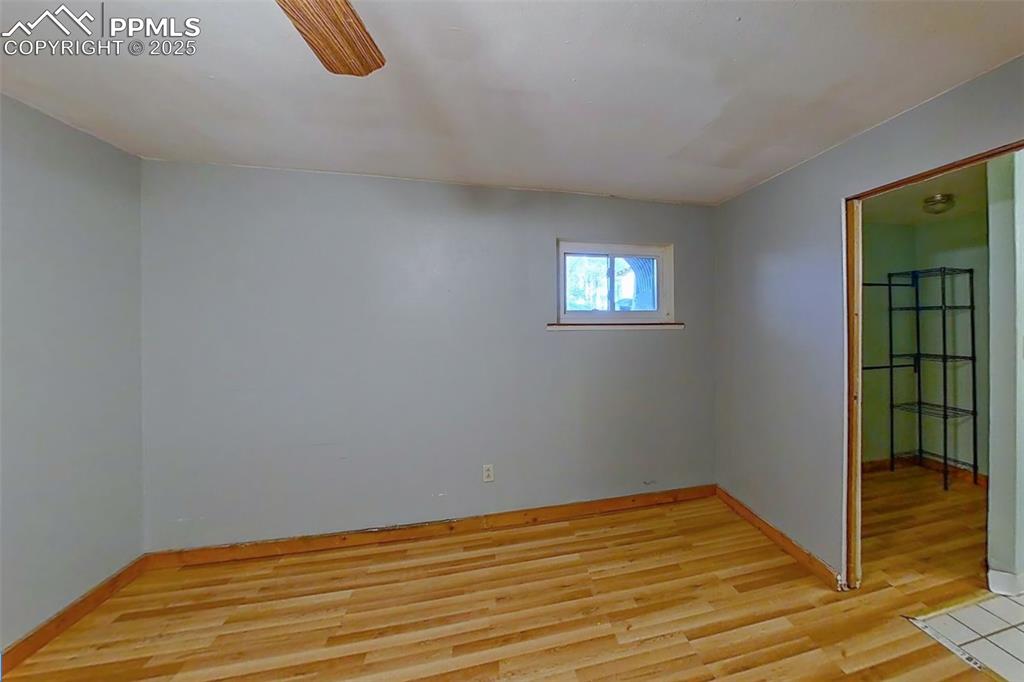 27720 Mid Jones Road Calhan, CO 80808 - Photo 24 of 43 a view of a room with wooden floor and a window