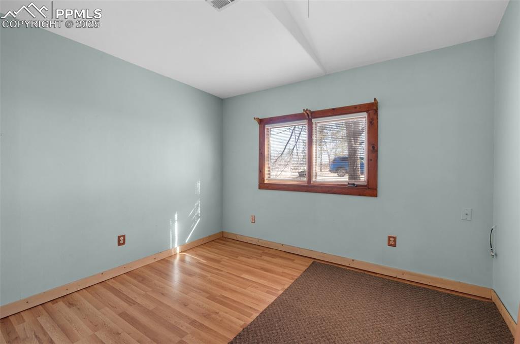 27720 Mid Jones Road Calhan, CO 80808 - Photo 30 of 43 a view of a room with wooden floor and windows