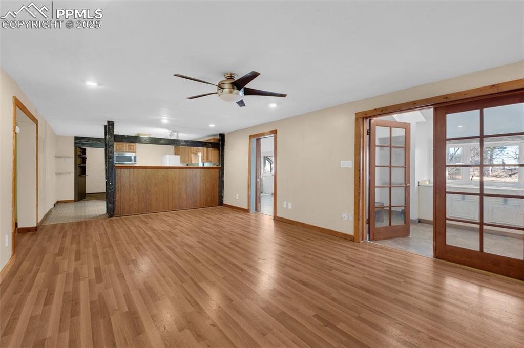 27720 Mid Jones Road Calhan, CO 80808 - Photo 6 of 43 a view of empty room with wooden floor and fan