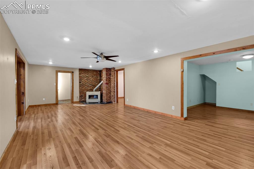 27720 Mid Jones Road Calhan, CO 80808 - Photo 10 of 43 a view of a livingroom with wooden floor and window