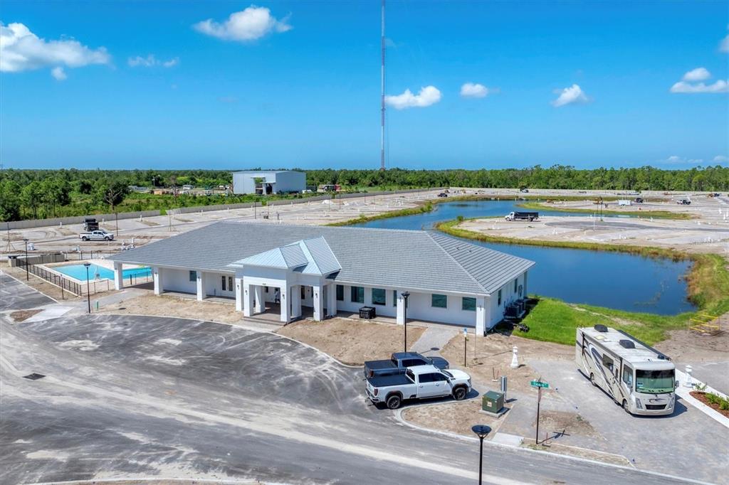 9001 Gasparilla Road, Unit 85 Placida, FL 33947 - Photo 17 of 75 a aerial view of a house with swimming pool and patio