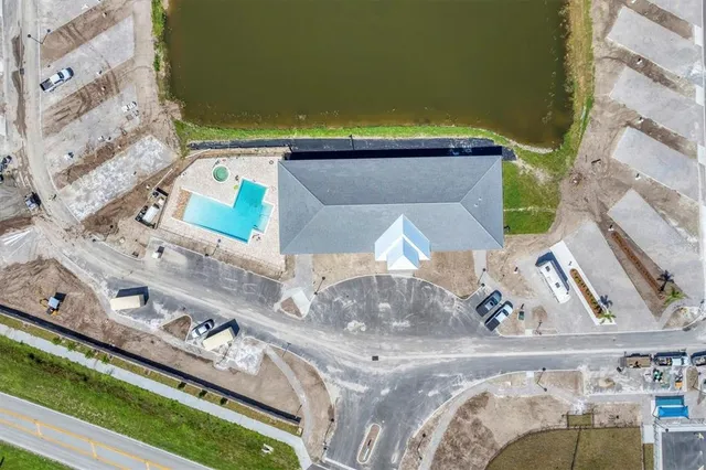 a view of a swimming pool with a yard