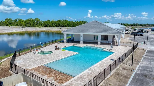 a view of a swimming pool with an outdoor space and seating