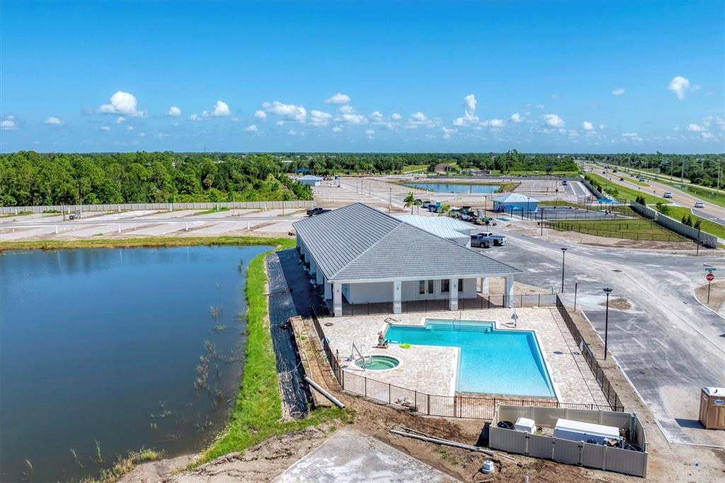 9001 Gasparilla Road, Unit 85 Placida, FL 33947 - Photo 45 of 75 a view of a swimming pool with an outdoor space and seating area