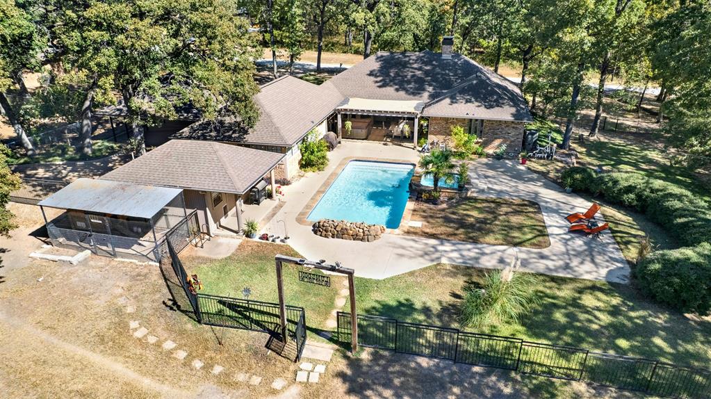 an aerial view of a house with garden space and street view