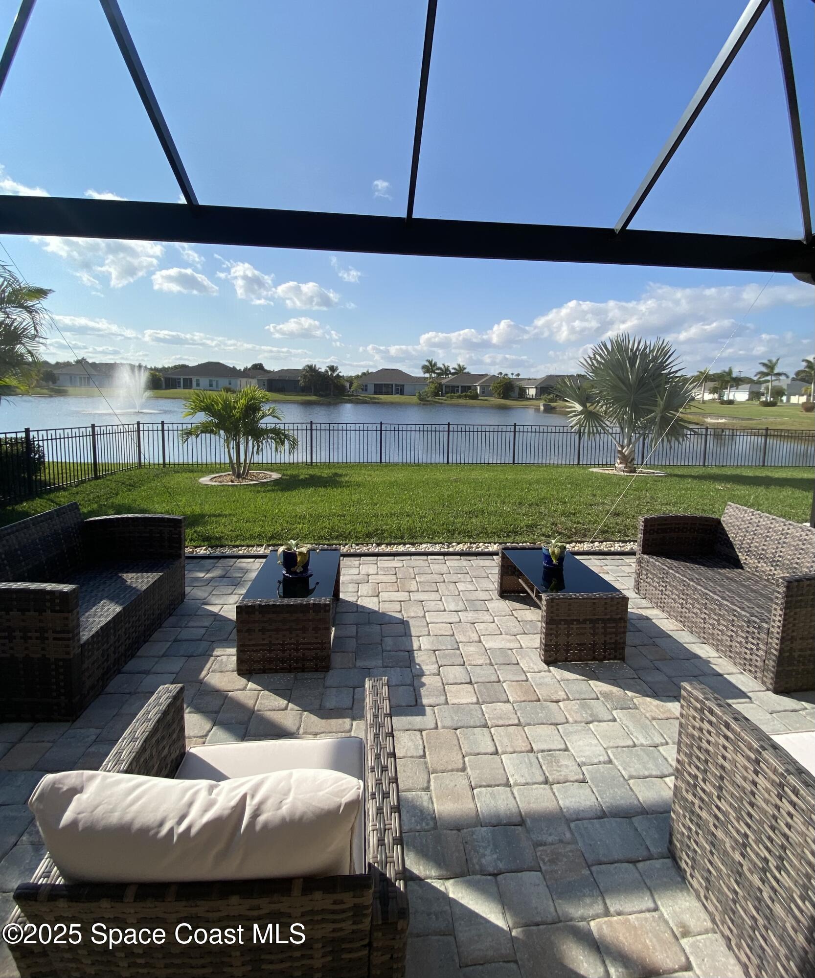 4290 Negal Circle Melbourne, FL 32901 - Photo 2 of 6 a outdoor living space with furniture and city view