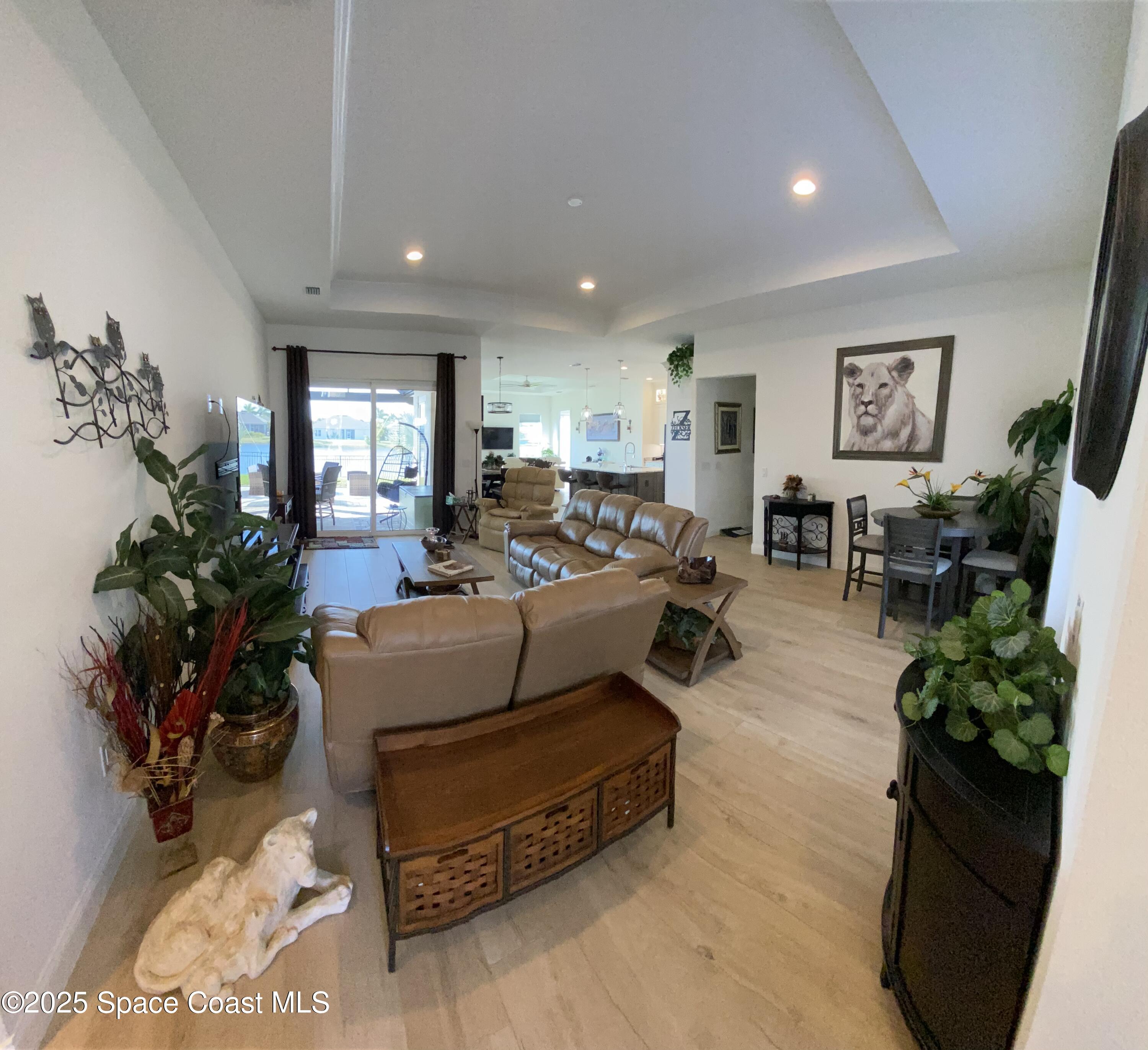 4290 Negal Circle Melbourne, FL 32901 - Photo 3 of 6 a living room with furniture potted plant and a window