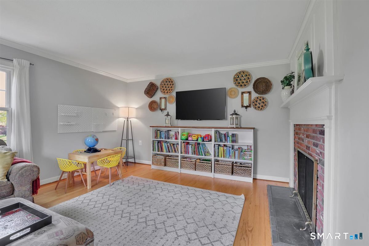 72 Old Post Road Wethersfield, CT 06109 - Photo 6 of 40 a room with furniture and a flat screen tv