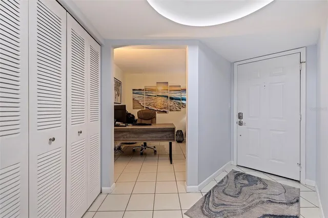 a view of a livingroom with furniture and front door