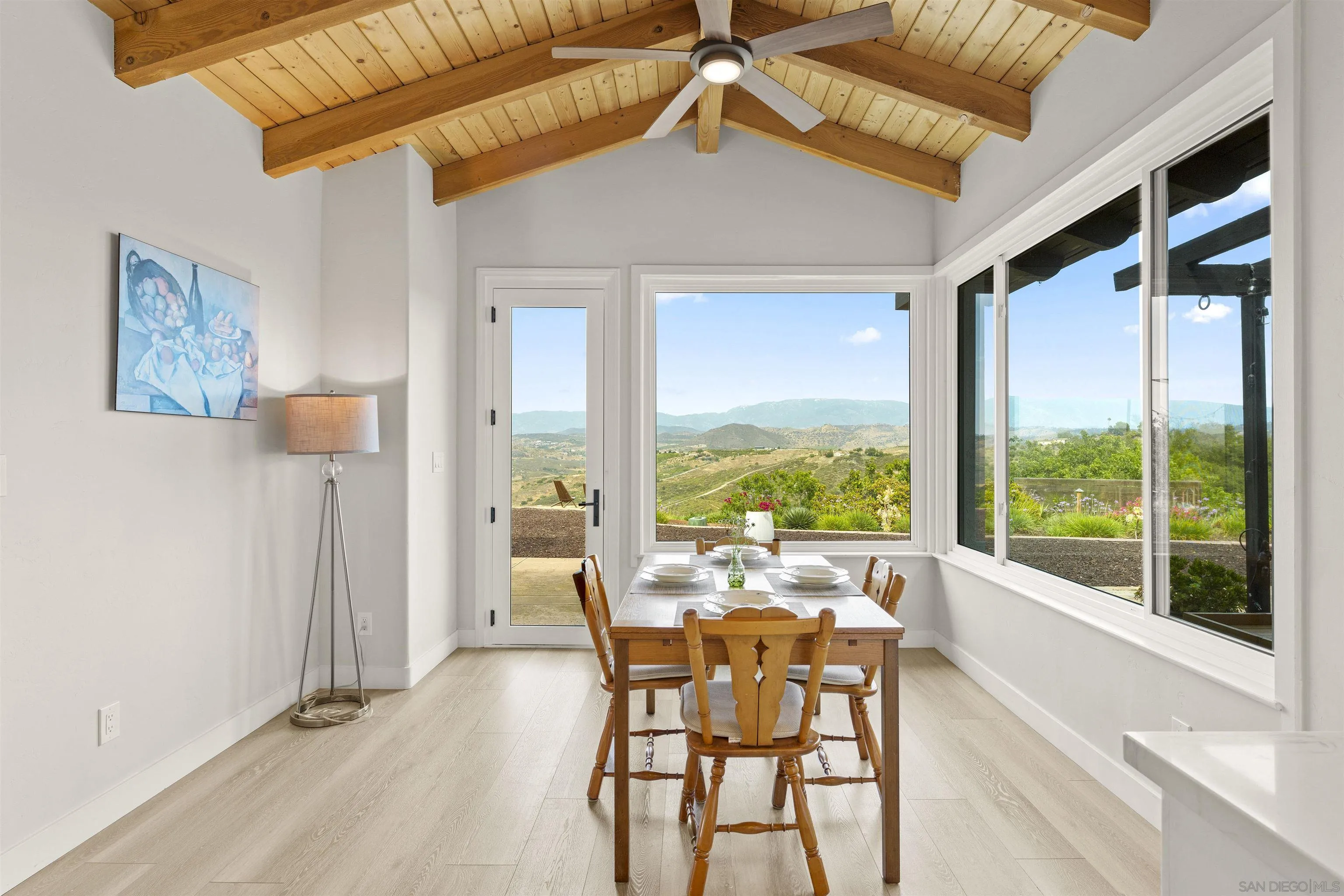 30659 Diaz Road Valley Center, CA 92082 - Photo 10 of 44 a dining room with furniture water view and a floor to ceiling window