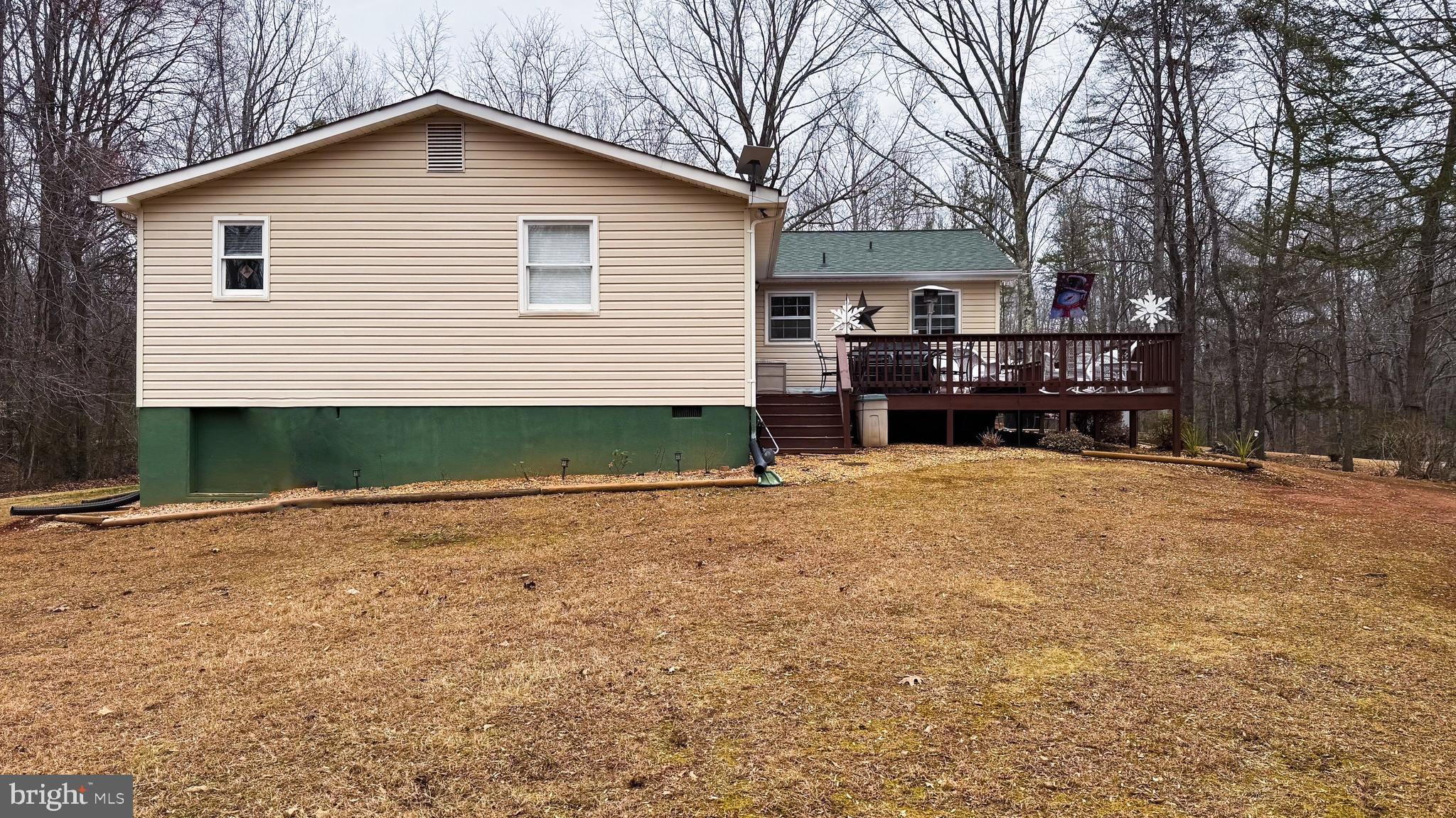 15366 Black Hill Road Rixeyville, VA 22737 - Photo 4 of 6 a view of a house with a yard and garage