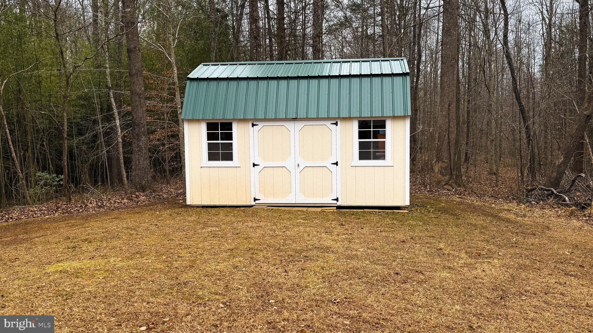 15366 Black Hill Road Rixeyville, VA 22737 - Photo 6 of 6 a view of a small house with backyard and garden