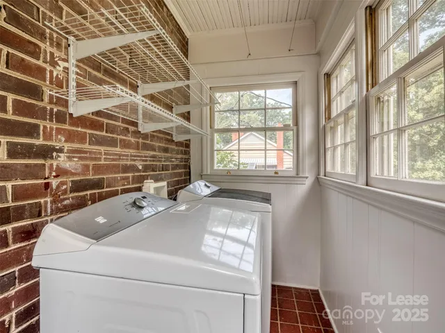 a bathroom with a sink a toilet and a shower