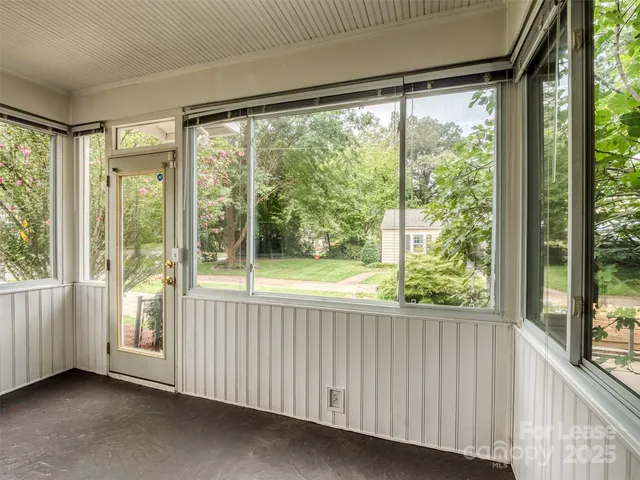 a view of an empty room with a large window