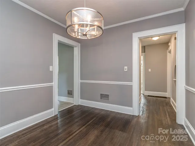 an empty room with wooden floor