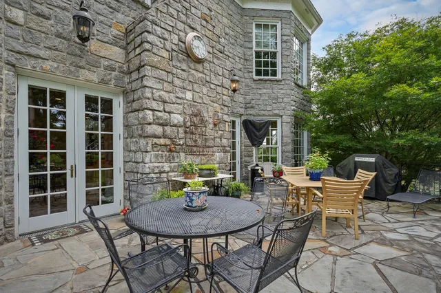 a front view of house with a garden