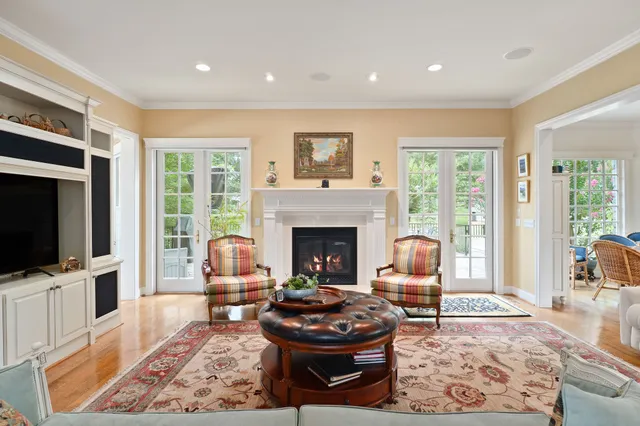 a kitchen with granite countertop white cabinets and a window
