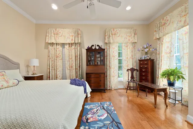 a bathroom with a double vanity sink mirror and chandelier