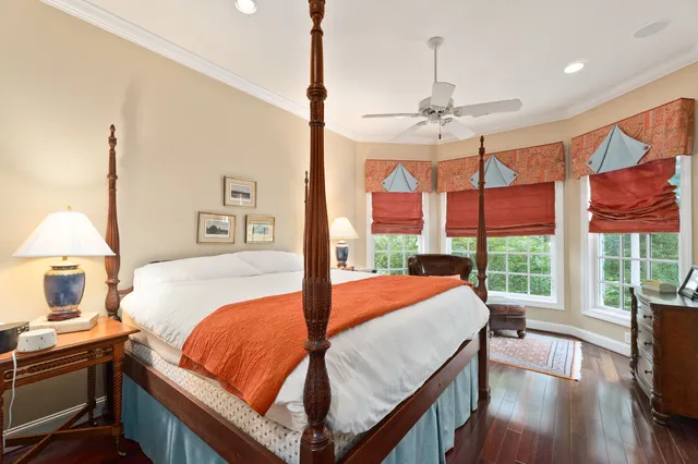 a bedroom with furniture and a flat screen tv