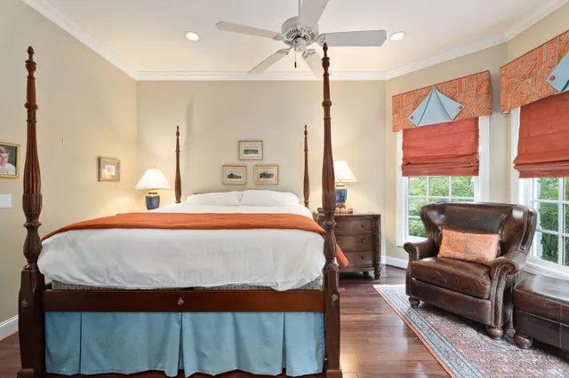 a bathroom with a granite countertop shower a toilet and a shower