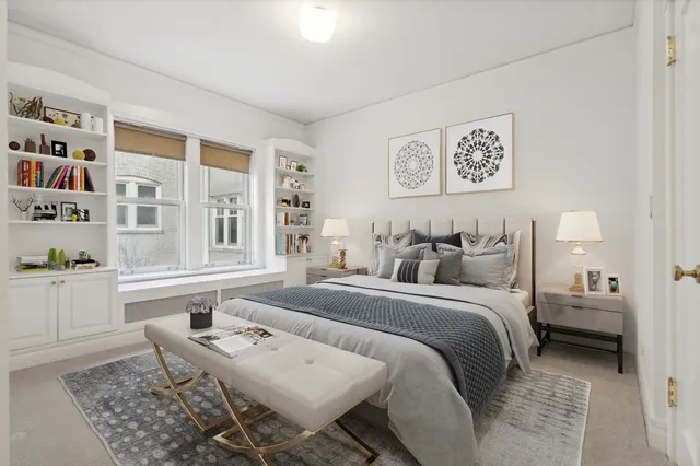 a bed room with a bed and a chair