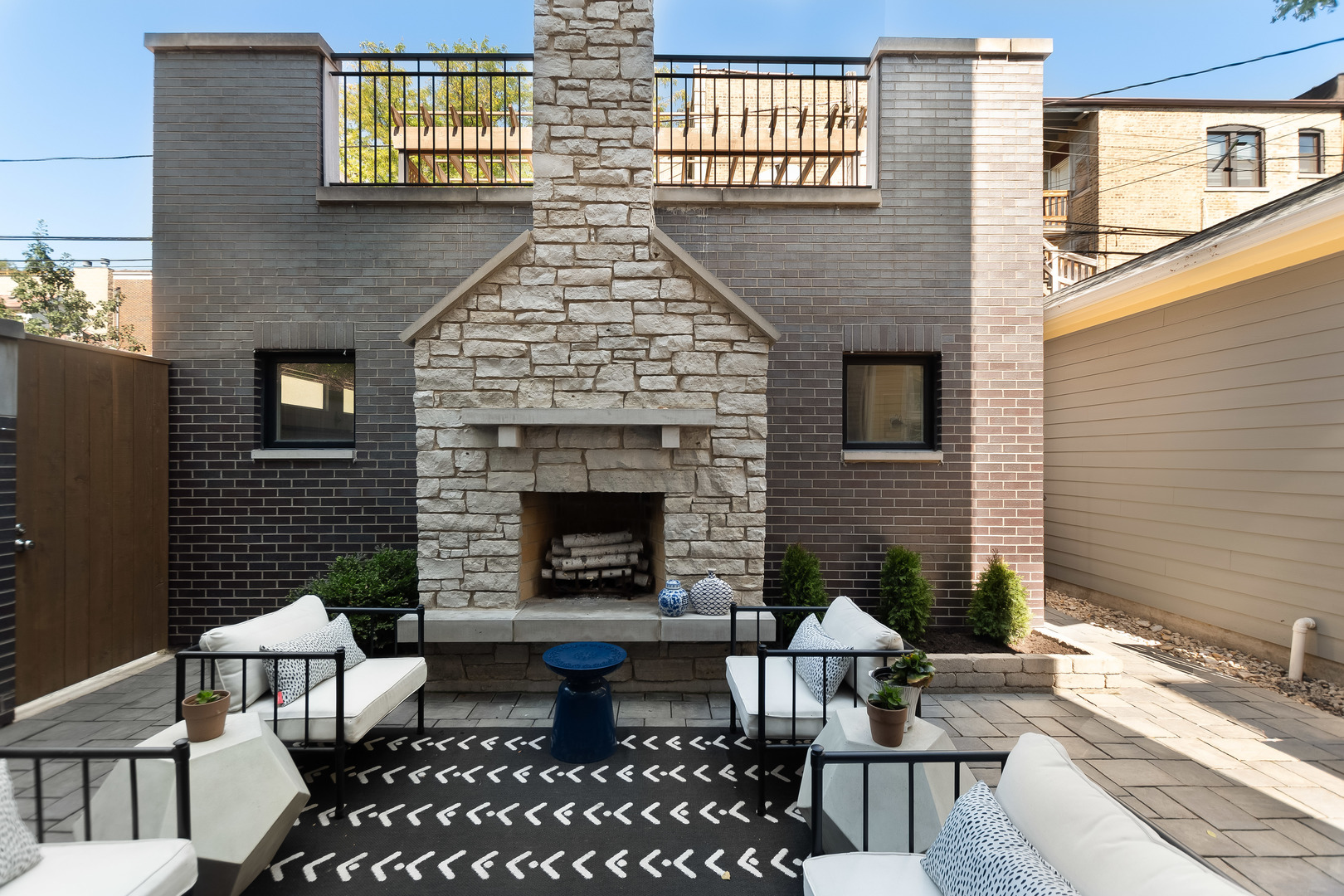 1480 West Grace Street Chicago, IL 60613 - Photo 16 of 41 a backyard of a house with fire pit and couch