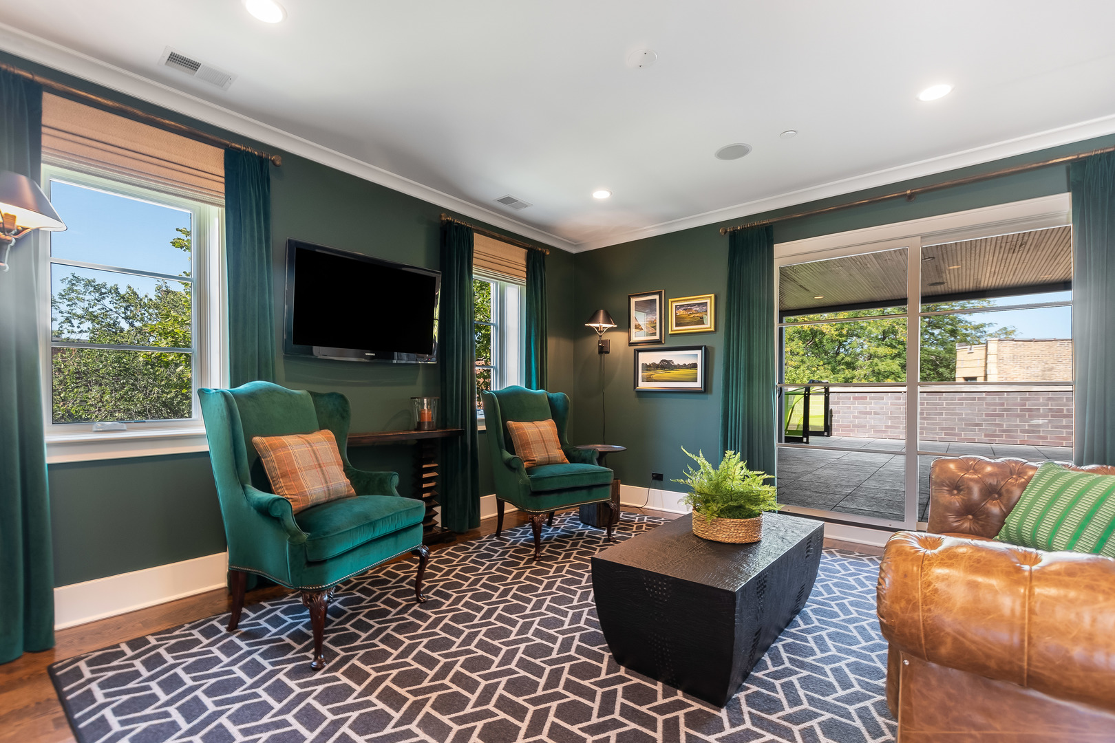 1480 West Grace Street Chicago, IL 60613 - Photo 31 of 41 a living room with furniture a flat screen tv and a large window