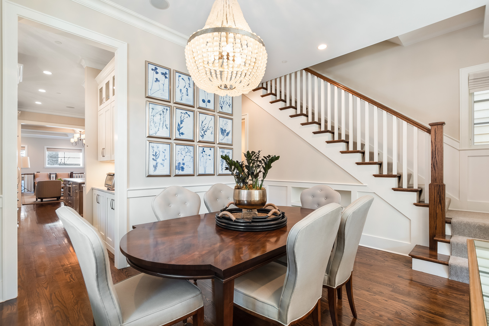 1480 West Grace Street Chicago, IL 60613 - Photo 6 of 41 a view of a dining room with furniture a chandelier and wooden floor