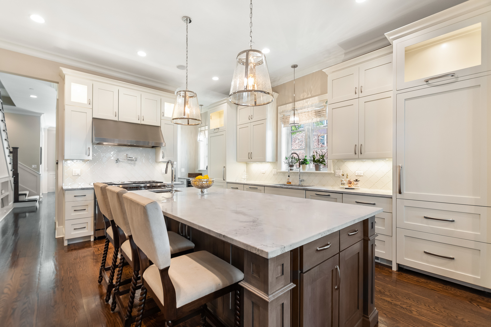 1480 West Grace Street Chicago, IL 60613 - Photo 8 of 41 a kitchen with a table chairs refrigerator and wooden floor