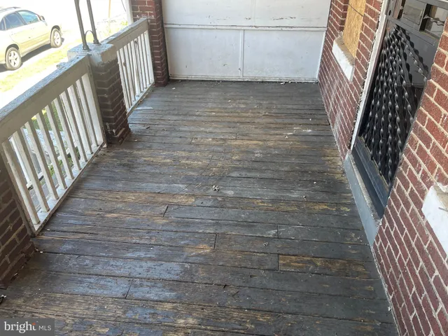 a kitchen with granite countertop a sink a stove and refrigerator